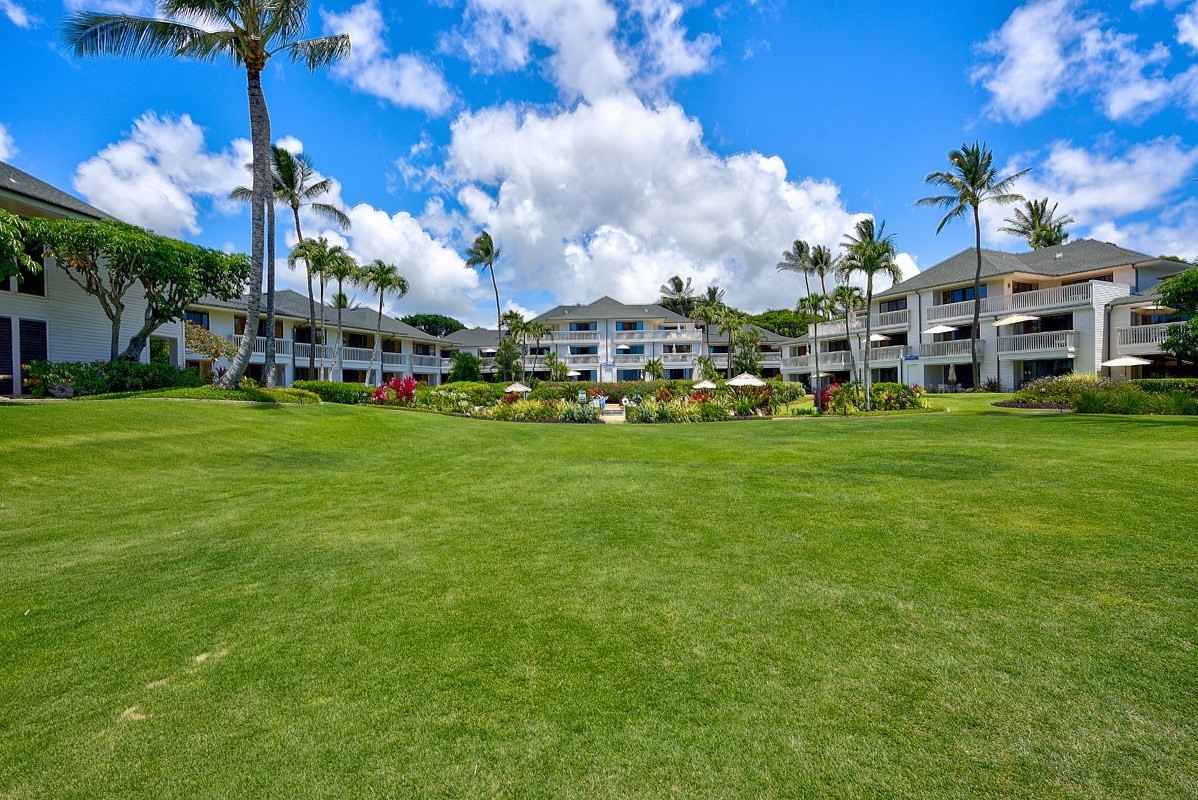 2221 Kapili Road, Unit 52 Koloa, HI 96756 - Photo 22 of 26 a view of a building with a yard