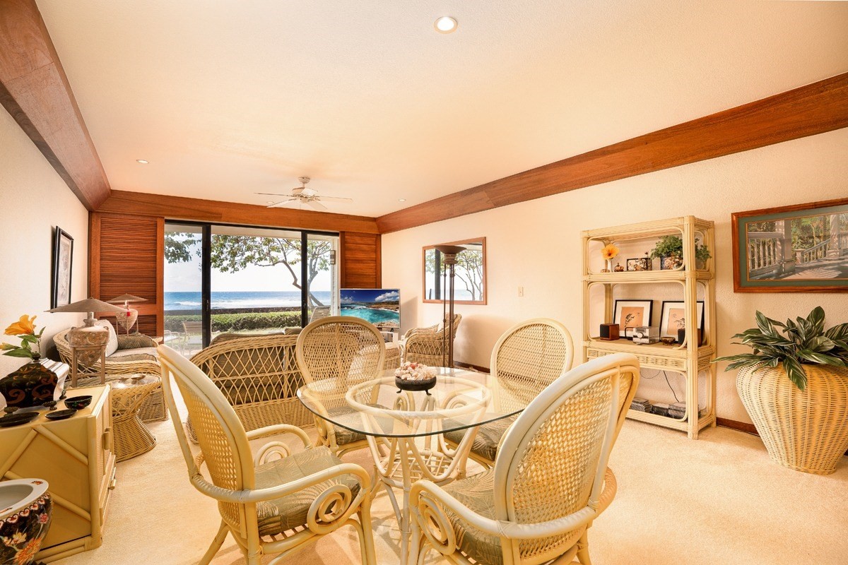 2221 Kapili Road, Unit 52 Koloa, HI 96756 - Photo 3 of 26 a living room with furniture and floor to ceiling windows