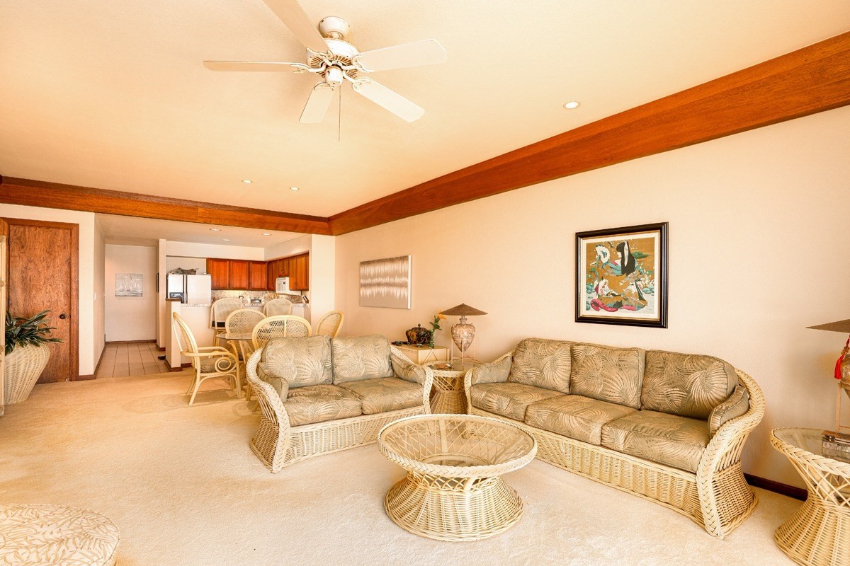 2221 Kapili Road, Unit 52 Koloa, HI 96756 - Photo 4 of 26 a living room with furniture and a large window