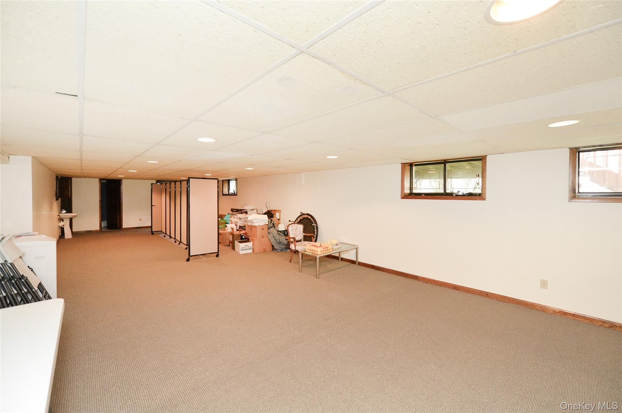 24 Highview Road Monsey, NY 10952 - Photo 36 of 44 a big room with closet and a chandelier fan