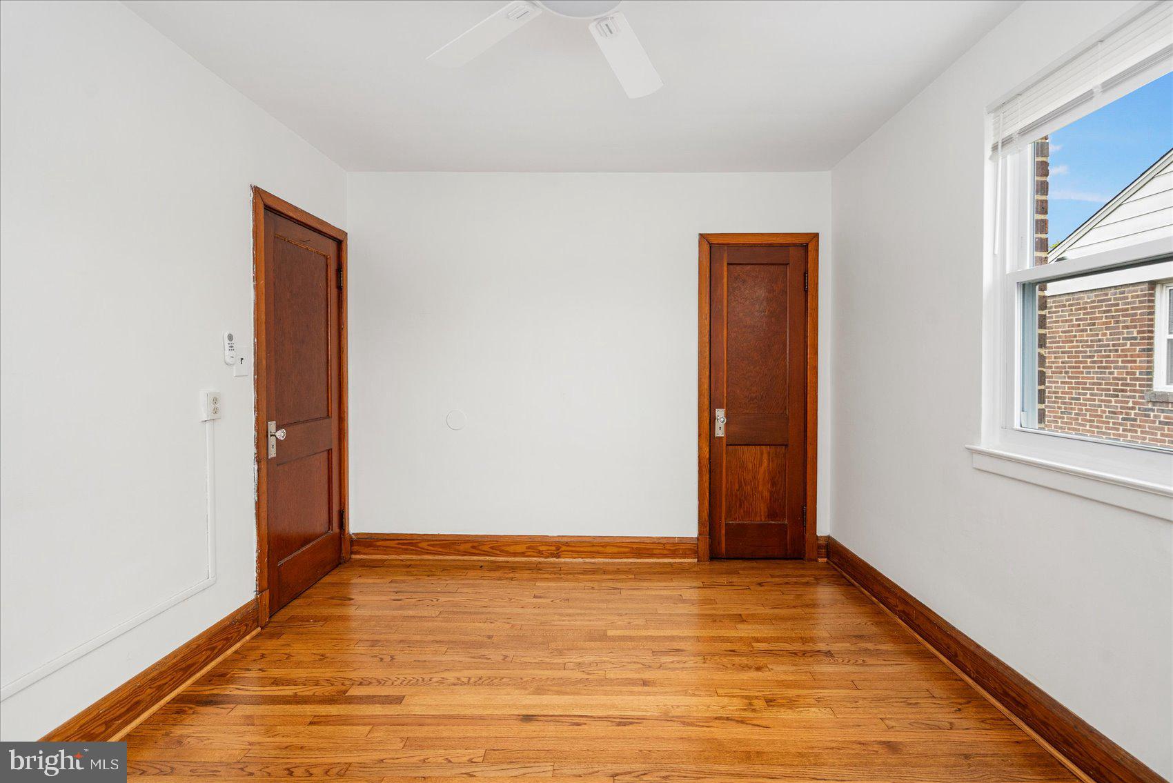 98 Kentway Baltimore, MD 21222 - Photo 15 of 35 an empty room with wooden floor and windows