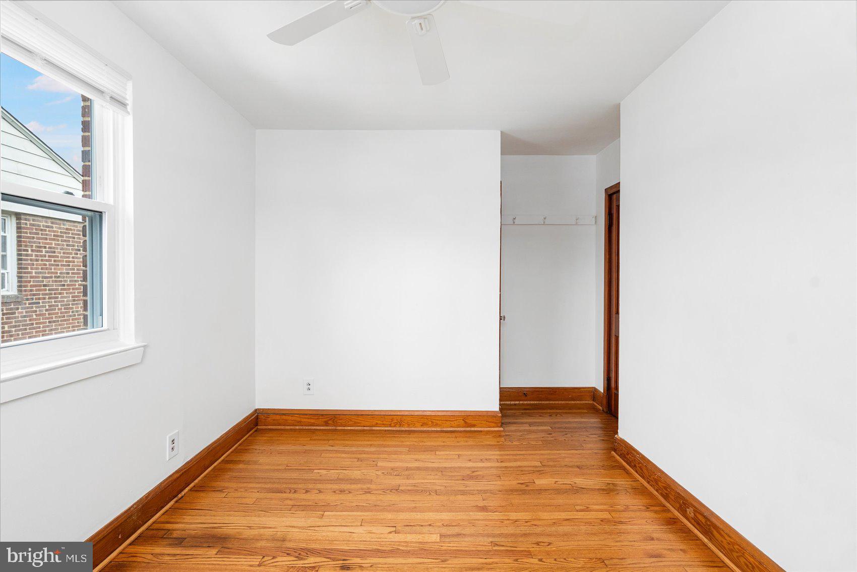 98 Kentway Baltimore, MD 21222 - Photo 20 of 35 a view of room with window and wooden floor