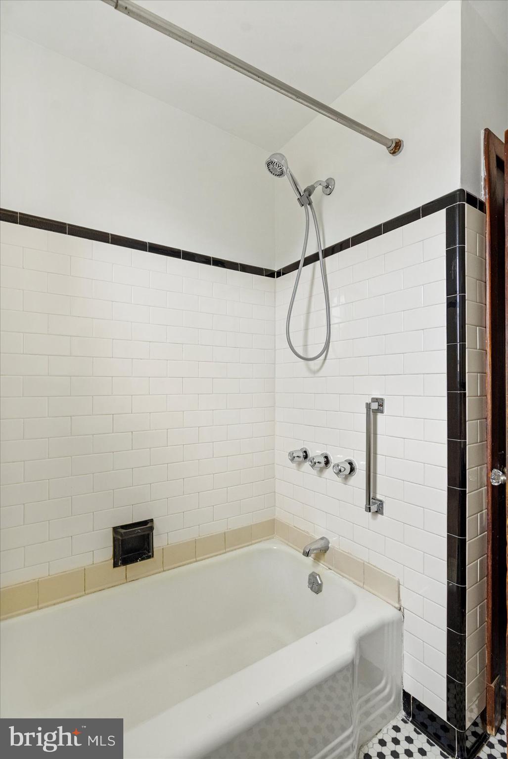 98 Kentway Baltimore, MD 21222 - Photo 24 of 35 a bathroom with a bathtub and a shower