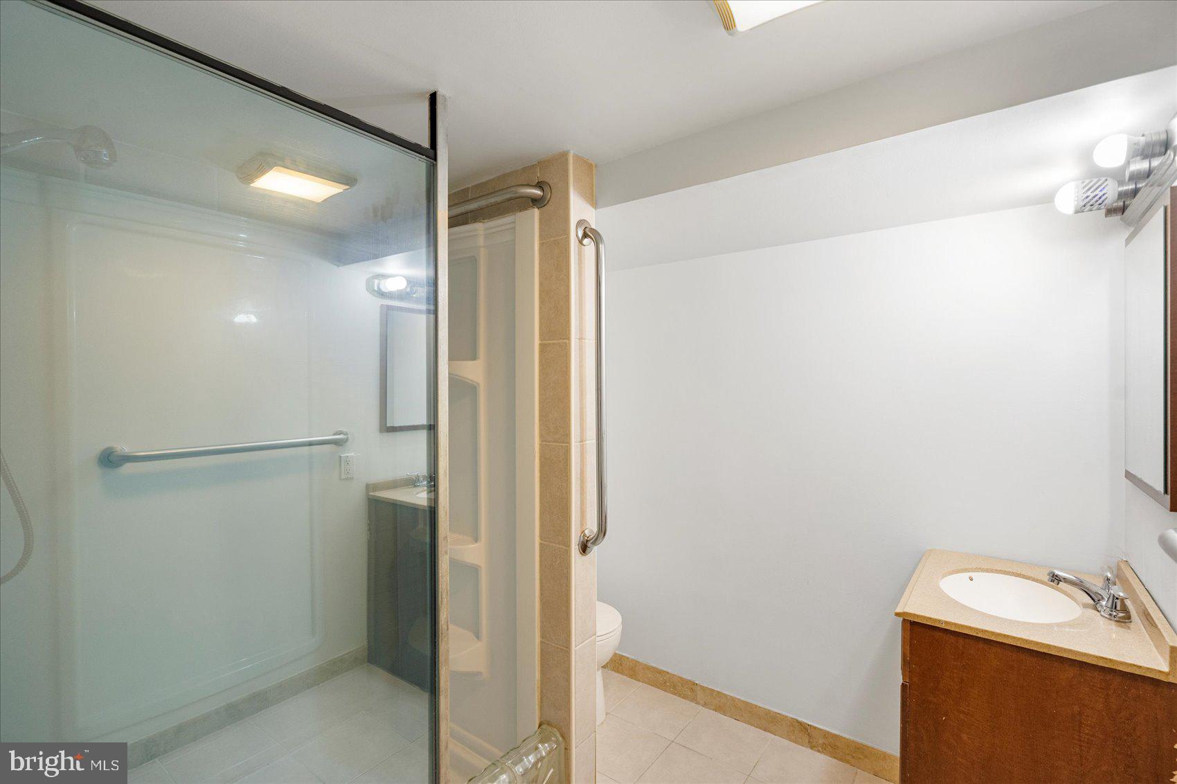 98 Kentway Baltimore, MD 21222 - Photo 28 of 35 a bathroom with a shower and a sink