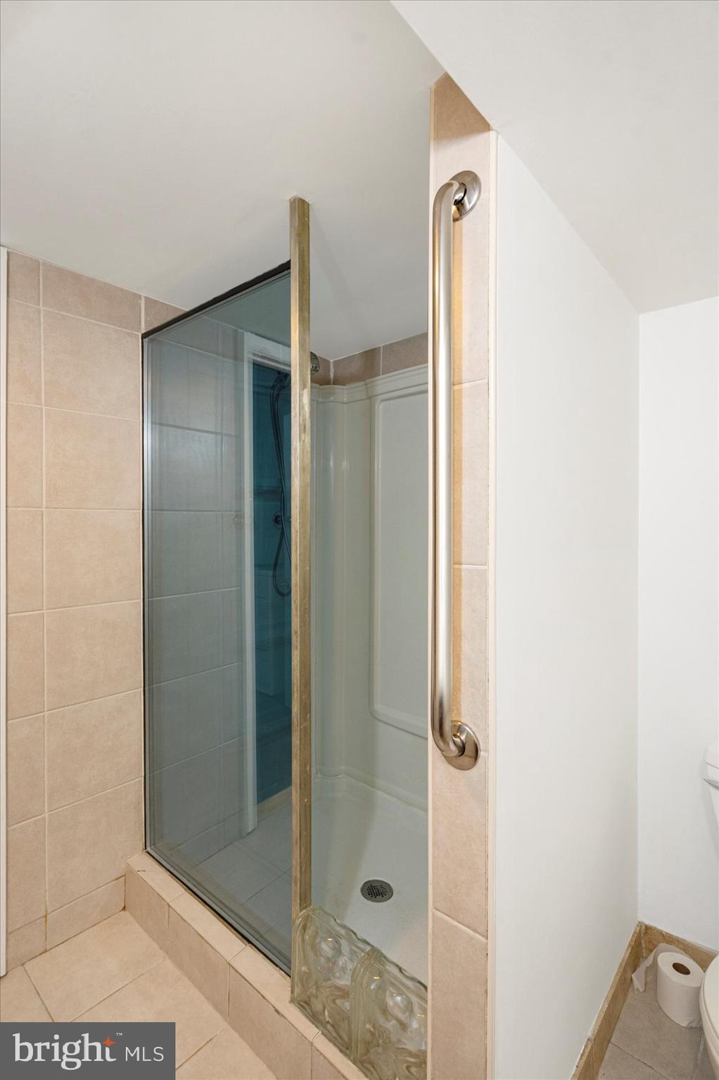 98 Kentway Baltimore, MD 21222 - Photo 29 of 35 a bathroom with a shower and a mirror