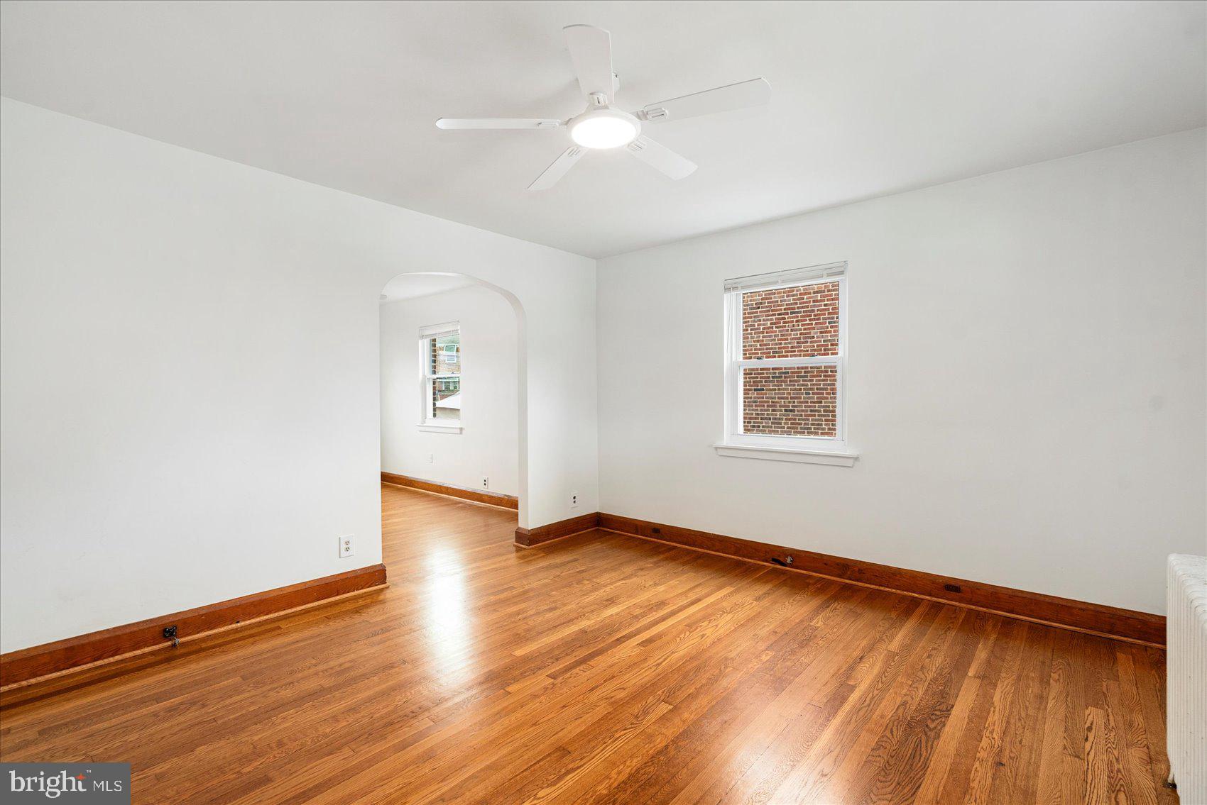 98 Kentway Baltimore, MD 21222 - Photo 5 of 35 an empty room with wooden floor and windows