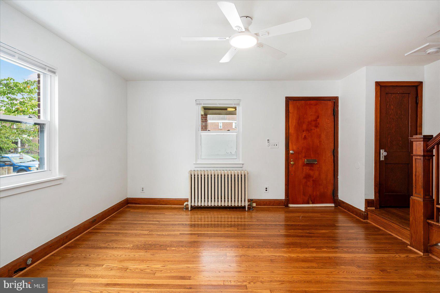 98 Kentway Baltimore, MD 21222 - Photo 7 of 35 wooden floor in an empty room with a window