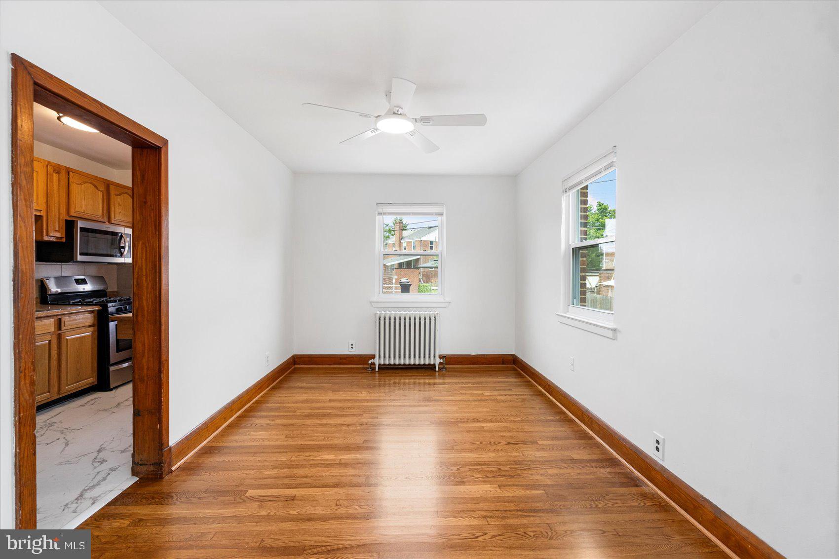 98 Kentway Baltimore, MD 21222 - Photo 8 of 35 wooden floor in an empty room with a window