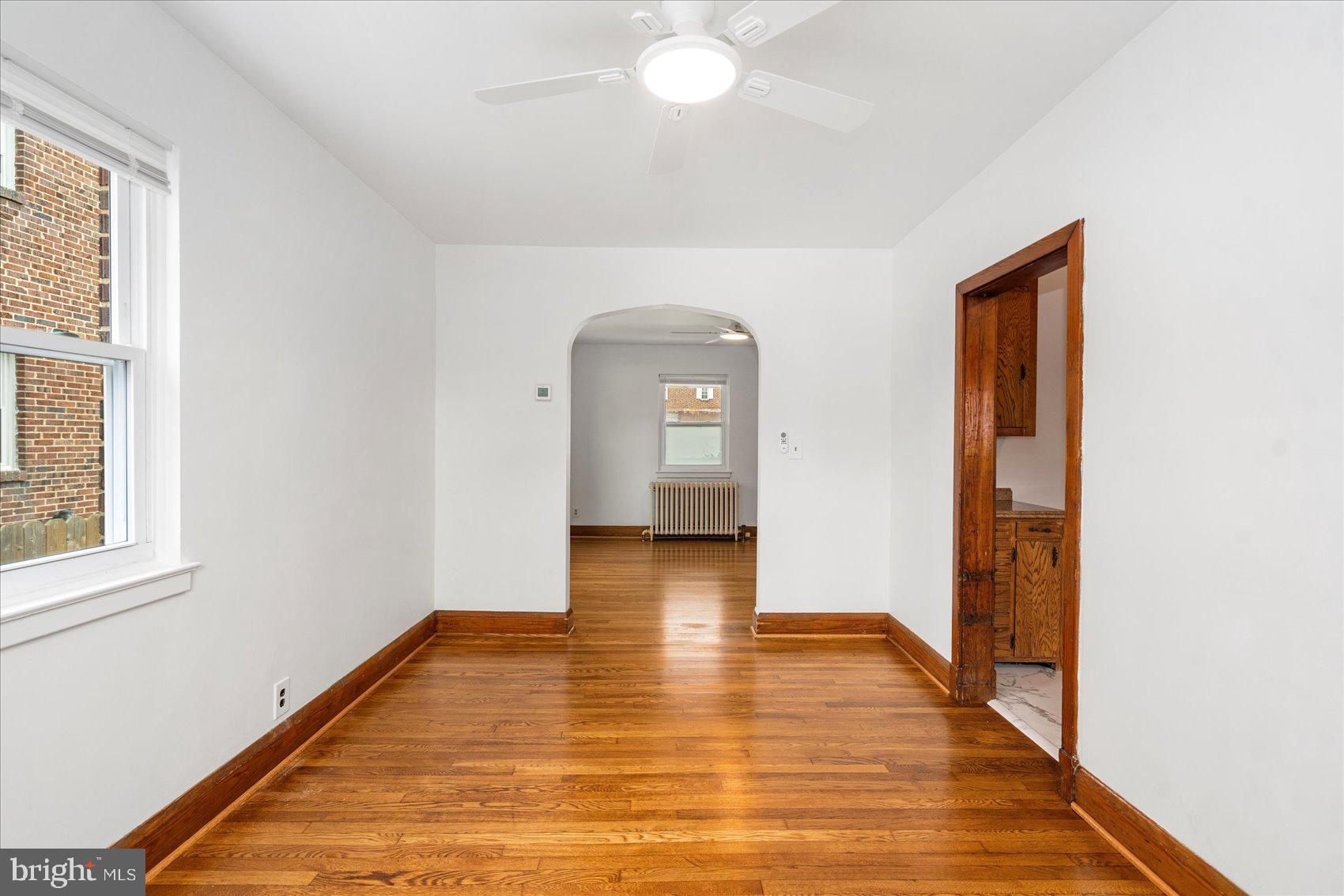98 Kentway Baltimore, MD 21222 - Photo 10 of 35 a view of empty room with wooden floor and fan