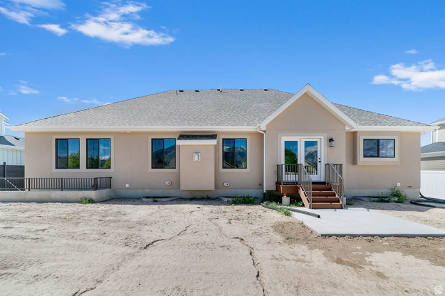 11711 South Halls Crk Road Draper, UT 84020 - Photo 5 of 31 Back of property featuring french doors, roof with shingles, a patio area, and stucco siding