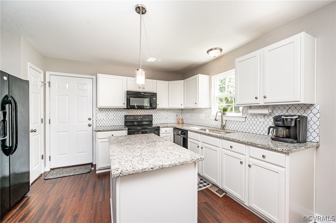 13063 Noel Road Beaverdam, VA 23047 - Photo 11 of 39 a kitchen with stainless steel appliances granite countertop a sink a stove a refrigerator and cabinets