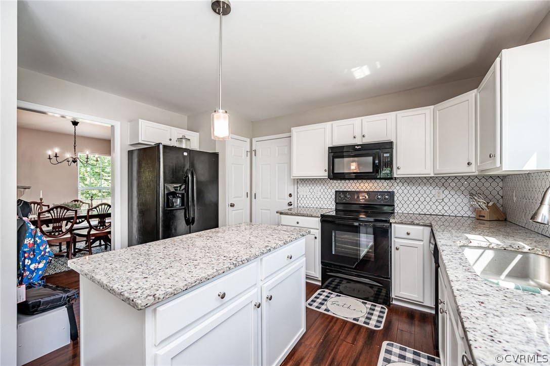 13063 Noel Road Beaverdam, VA 23047 - Photo 12 of 39 a kitchen with a stove a sink and a refrigerator