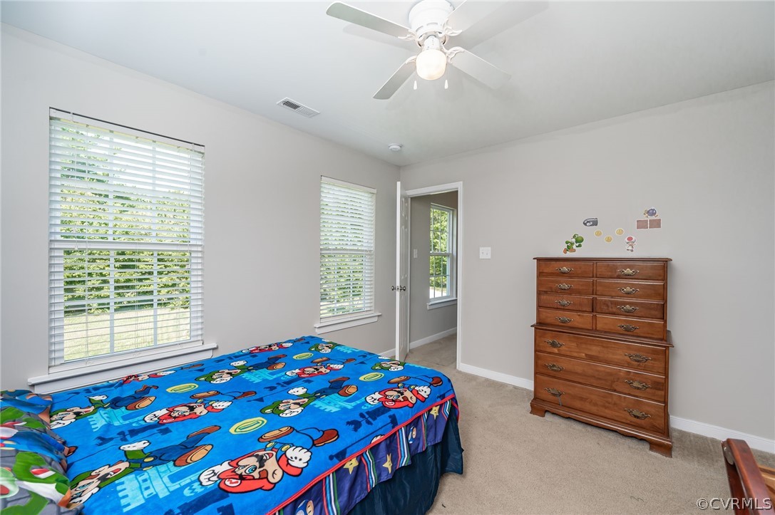 13063 Noel Road Beaverdam, VA 23047 - Photo 31 of 39 a bedroom with a bed and a dresser