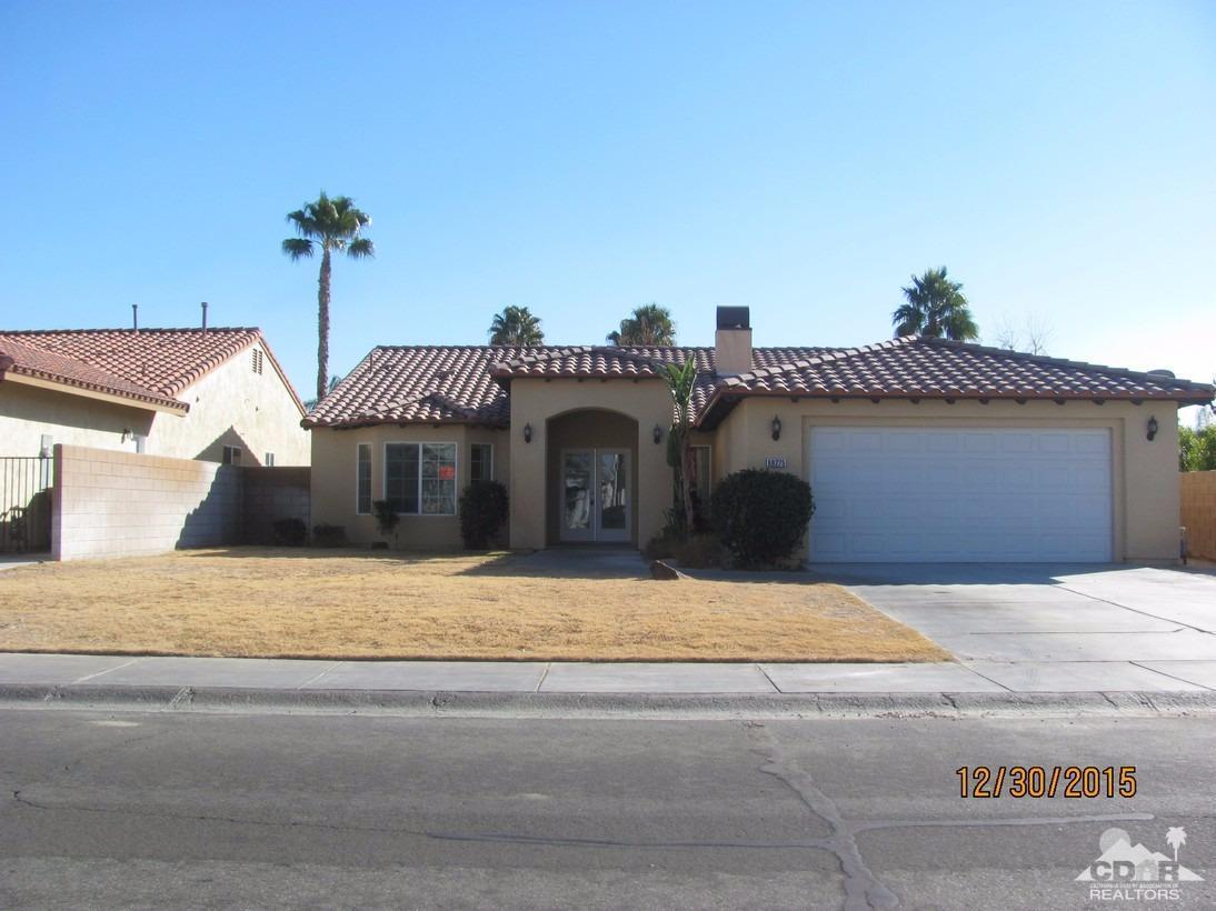 a view of a house with a street