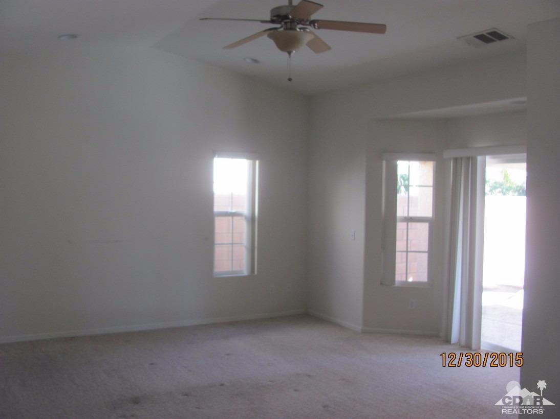 68275 Tortuga Road Cathedral City, CA 92234 - Photo 12 of 18 a view of an empty room with a window