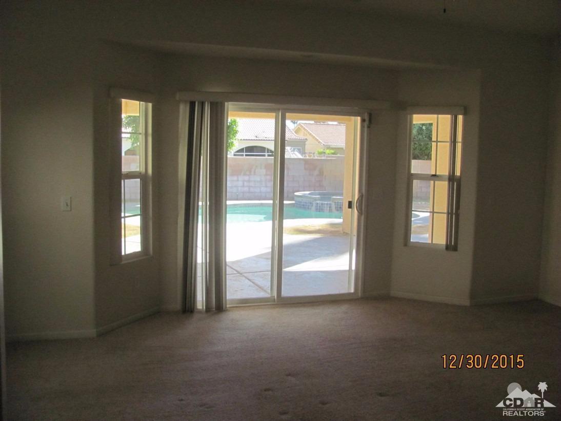 68275 Tortuga Road Cathedral City, CA 92234 - Photo 13 of 18 a view of an empty room with a window