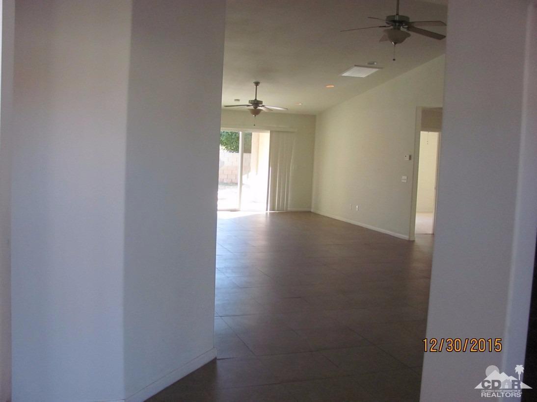 68275 Tortuga Road Cathedral City, CA 92234 - Photo 3 of 18 a view of an empty room with a window