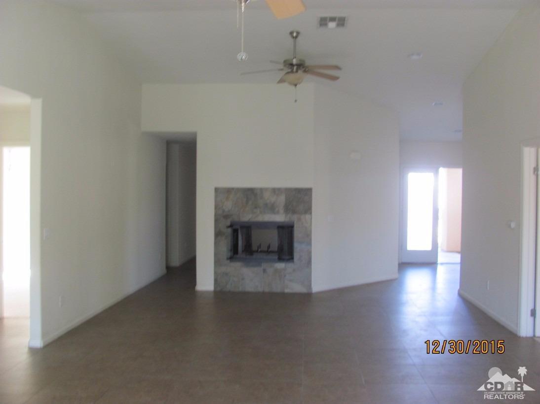 68275 Tortuga Road Cathedral City, CA 92234 - Photo 6 of 18 a view of a livingroom with a fireplace