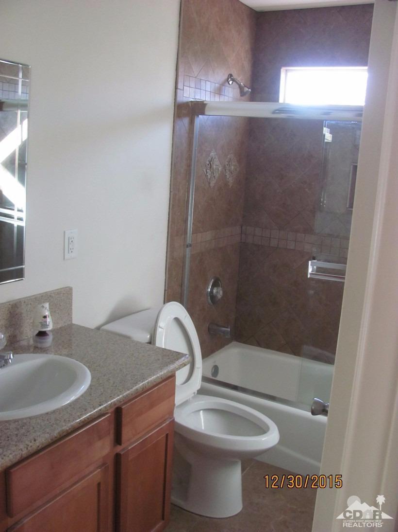 68275 Tortuga Road Cathedral City, CA 92234 - Photo 10 of 18 a bathroom with a sink a toilet and shower