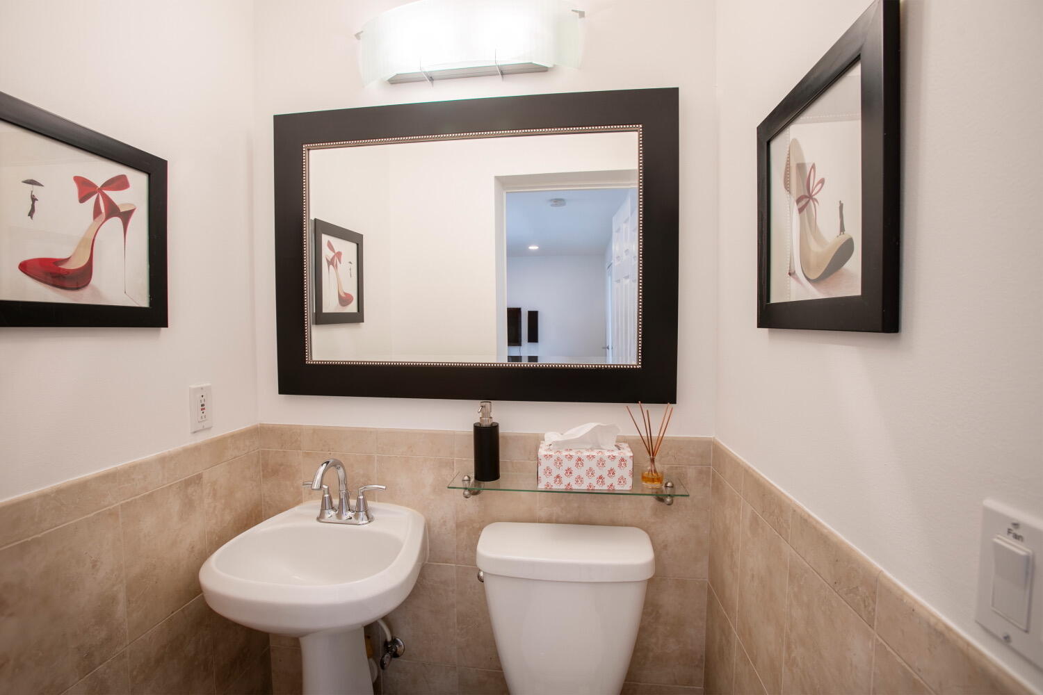 2631 Northeast 48th Street Lighthouse Point, FL 33064 - Photo 13 of 16 a bathroom with a toilet sink and mirror