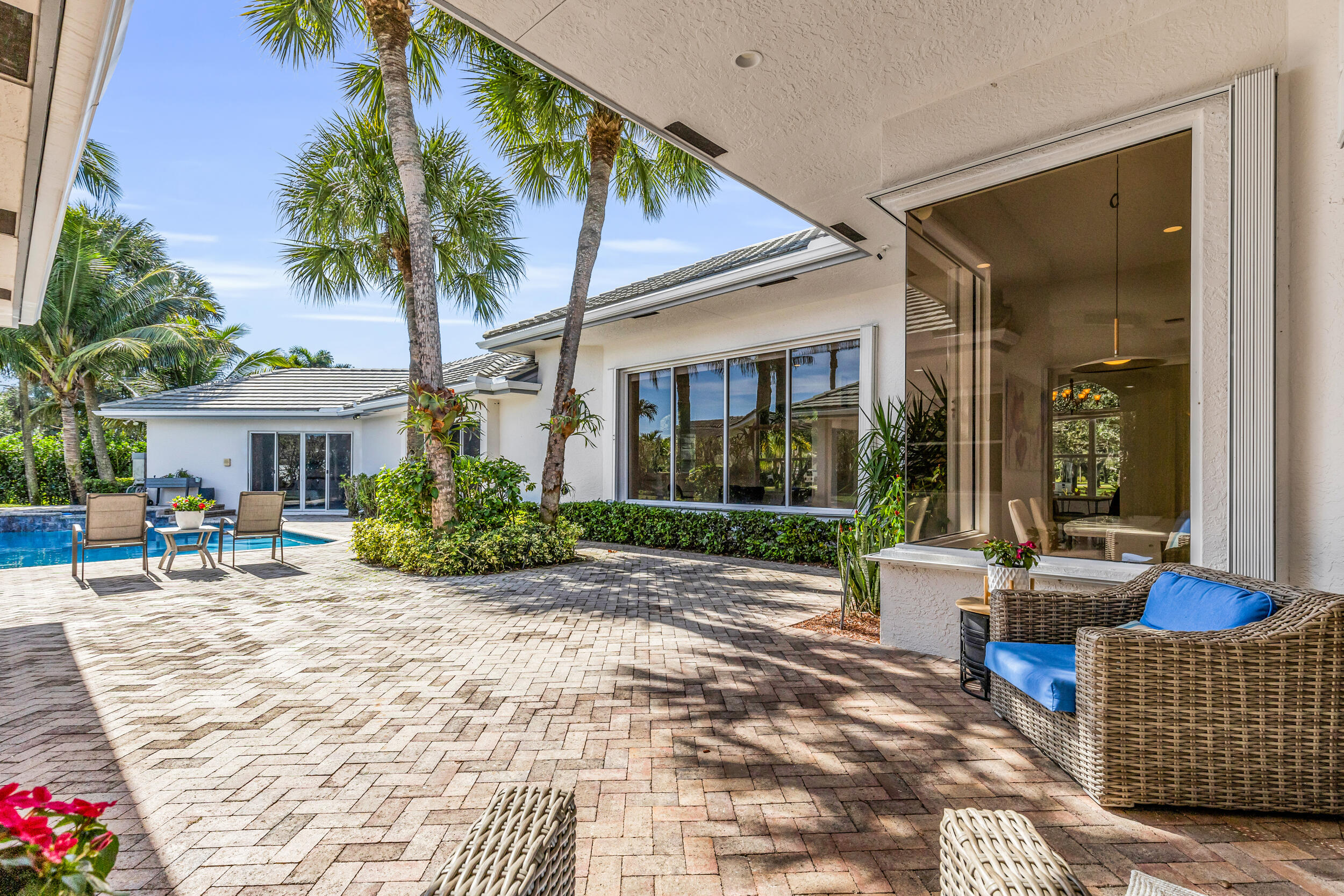 2375 Rabbit Hollowe Circle Delray Beach, FL 33445 - Photo 48 of 62 Covered Sitting Area Outside Family Room
