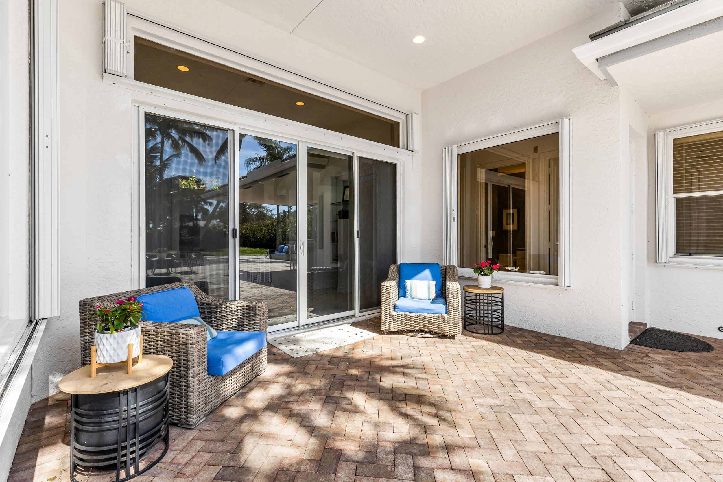 2375 Rabbit Hollowe Circle Delray Beach, FL 33445 - Photo 49 of 62 Covered Sitting Area Outside Family Room