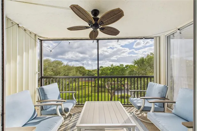 a view of a balcony with chair and table