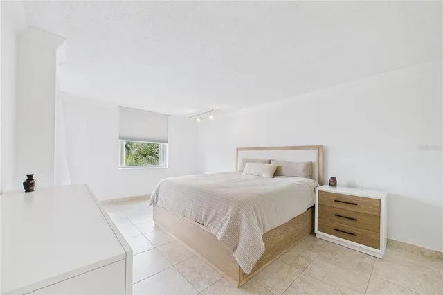 a bedroom with a bed and a cabinets