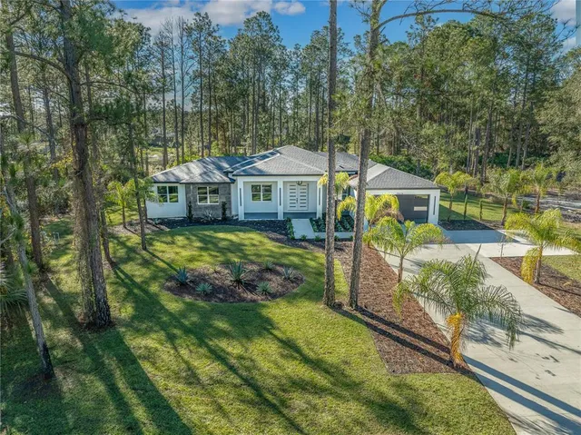 an aerial view of residential house with outdoor space