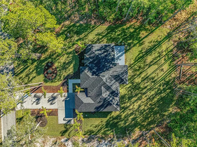 a view of an entryway with kitchen and dining area
