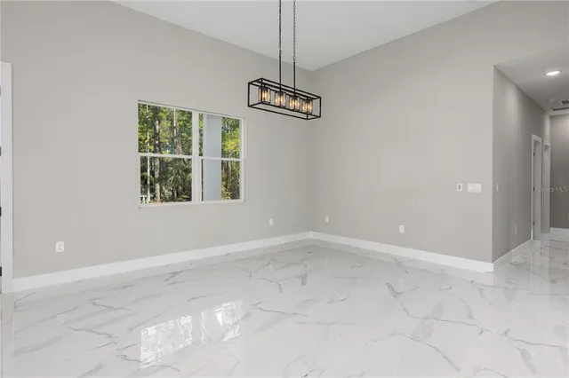 a close view of a sink and livingroom