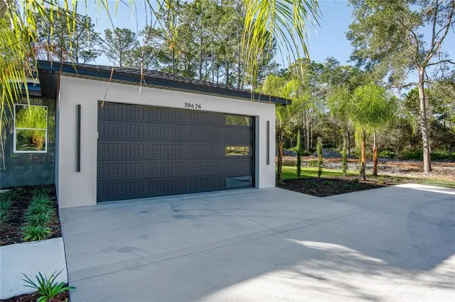 a view of a house with a garage