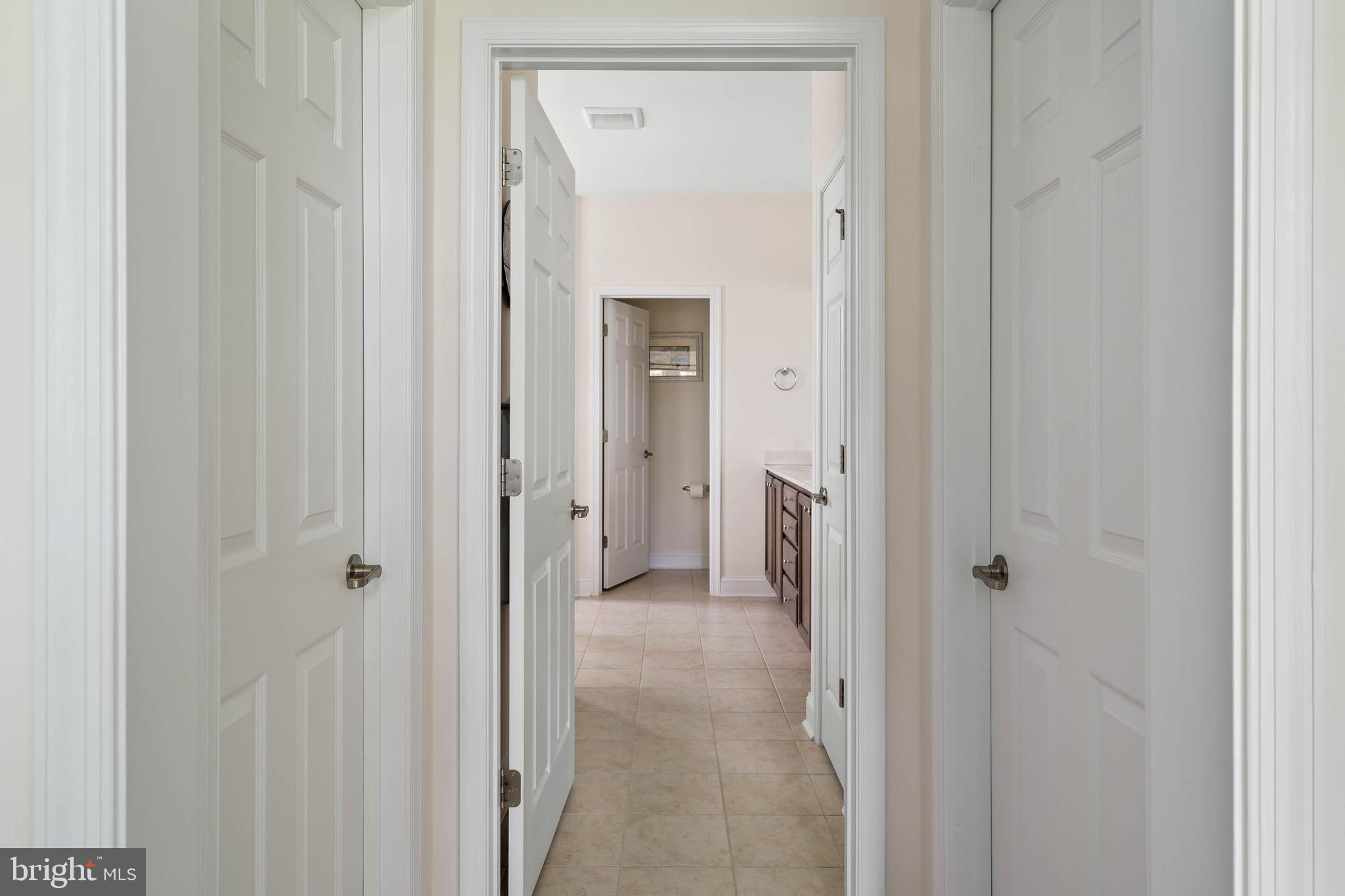 35228 Acadia Lane Lewes, DE 19958 - Photo 25 of 58 Hallway with His/Her Walk in Closets