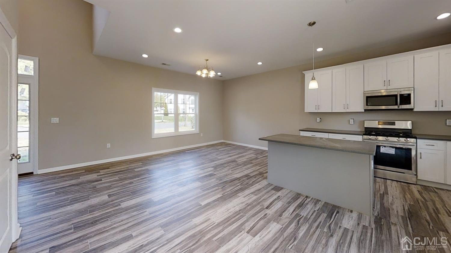 16 Idlewild Road Edison, NJ 08817 - Photo 2 of 15 a kitchen with granite countertop white cabinets and black appliances