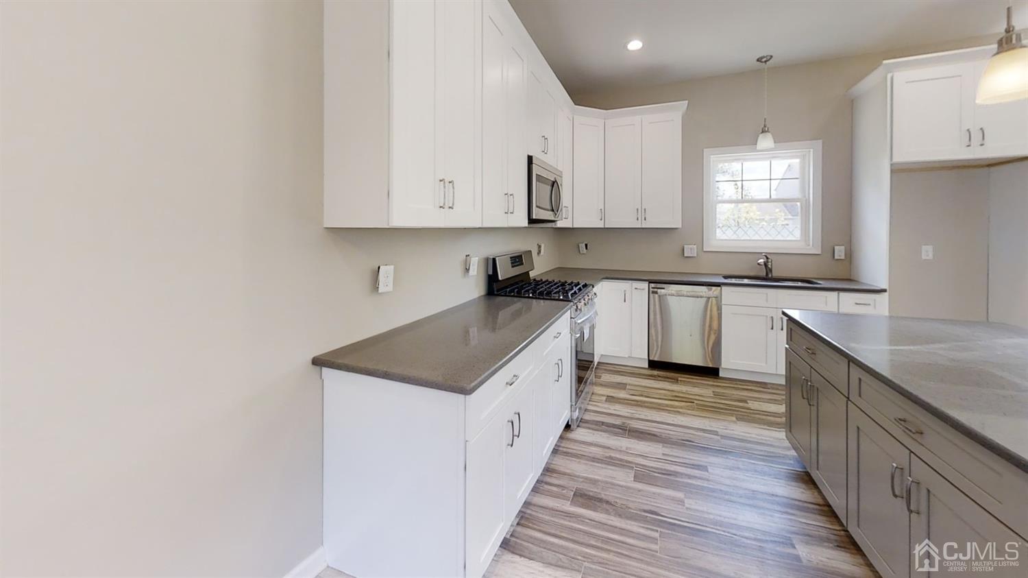 16 Idlewild Road Edison, NJ 08817 - Photo 5 of 15 a kitchen with a sink and cabinets