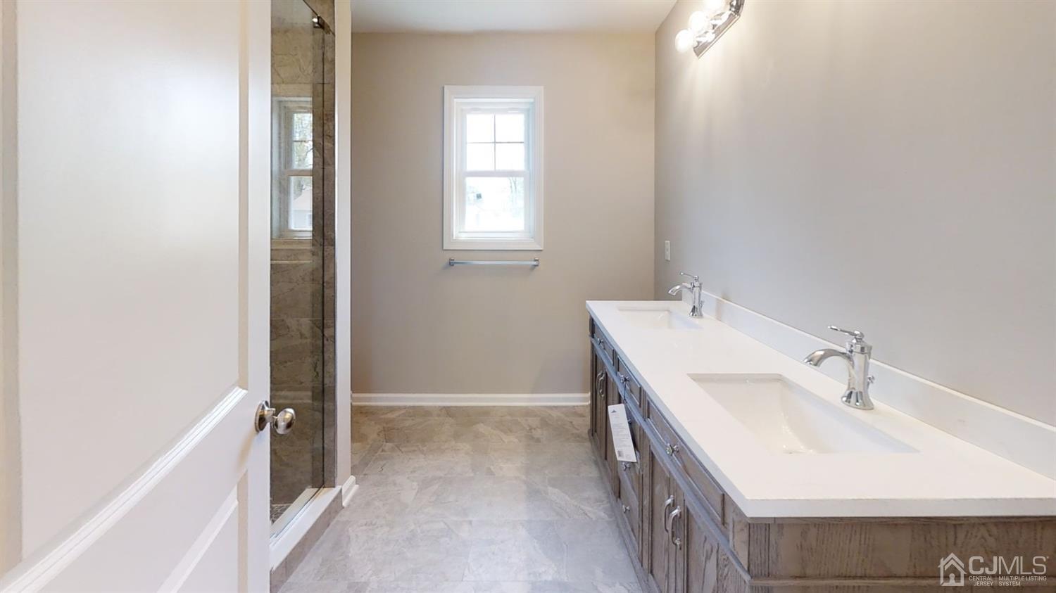 16 Idlewild Road Edison, NJ 08817 - Photo 10 of 15 a bathroom with a sink and a tub