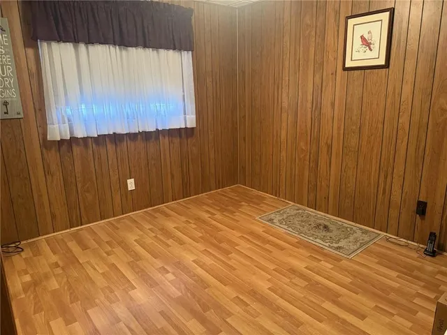 a bed room with a bed and a window