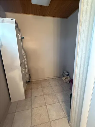 a backyard of a house with fountain table and chairs