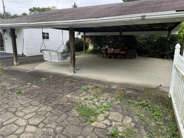 a view of a house with a porch and a garage