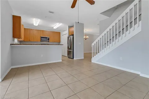 a view of kitchen with furniture and a window