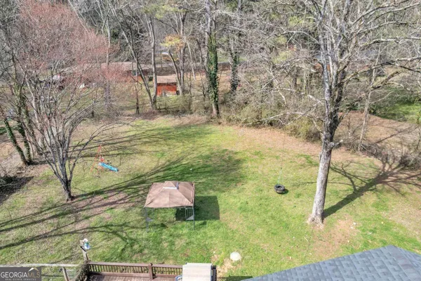 a house with trees in the background