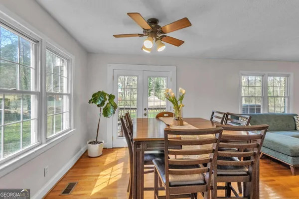 a view of a dining room with furniture window and outside view
