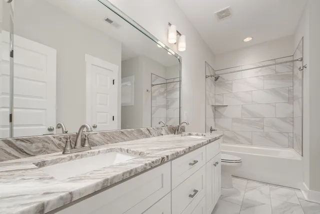 a bathroom with a granite countertop sink mirror and a