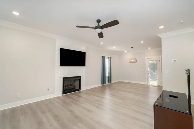 a view of an empty room with a fireplace
