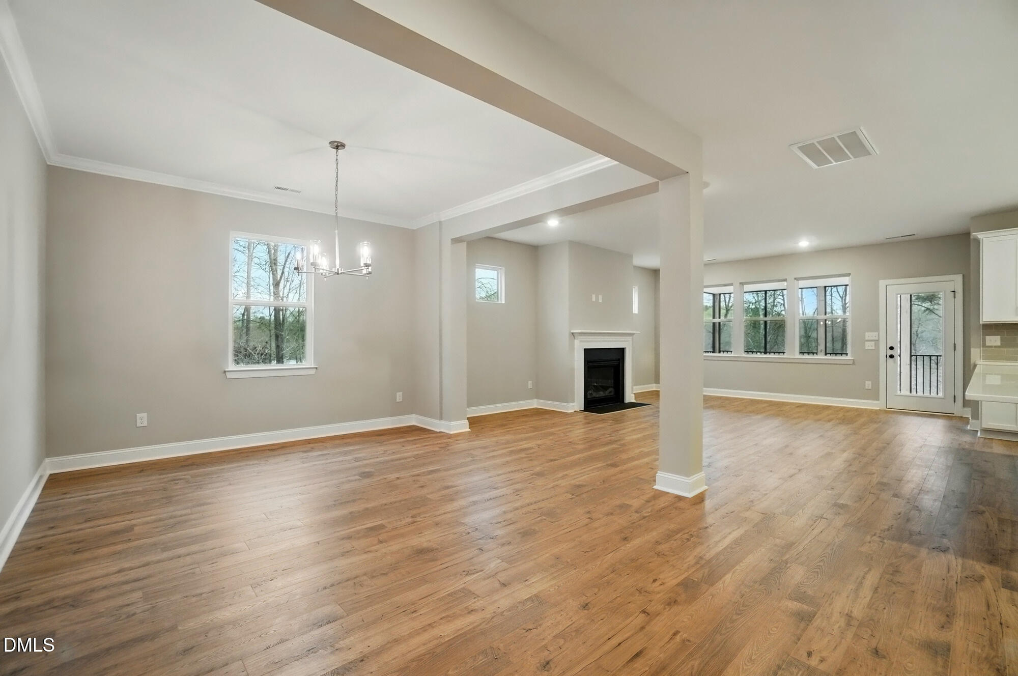 285 Gilliland Road Siler City, NC 27344 - Photo 5 of 45 a view of an empty room with window and wooden floor