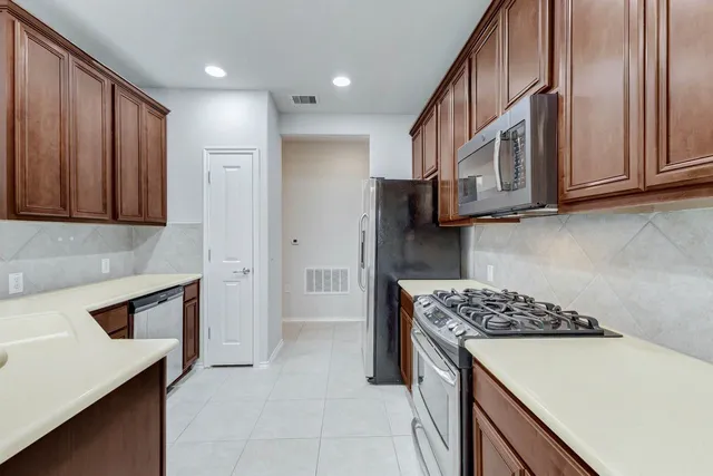 a kitchen with a stove and a microwave
