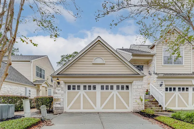 a front view of a house with garage