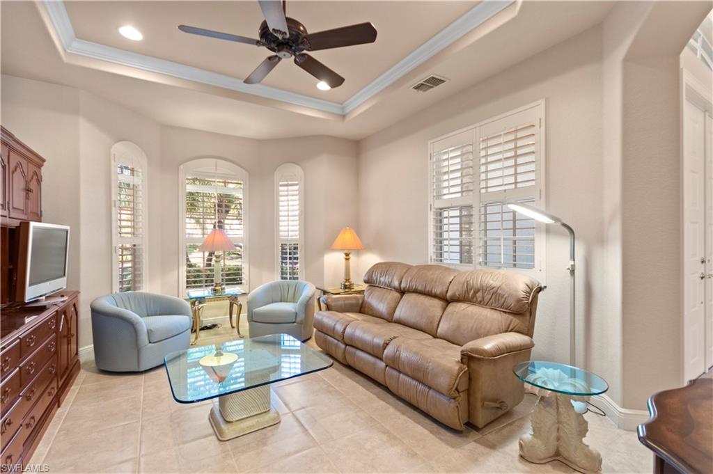 8855 Largo Mar Drive Estero, FL 33967 - Photo 11 of 50 a living room with furniture a ceiling fan and a window