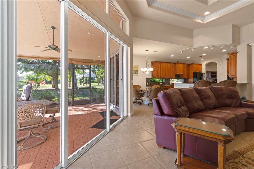 8855 Largo Mar Drive Estero, FL 33967 - Photo 17 of 50 a living room with furniture and a large window