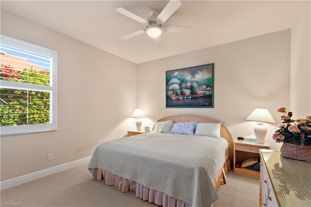 8855 Largo Mar Drive Estero, FL 33967 - Photo 30 of 50 a bedroom with bed and a window
